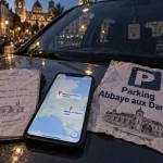 Parking abbaye aux dames : carte Saintes ou Caen sur pare-brise